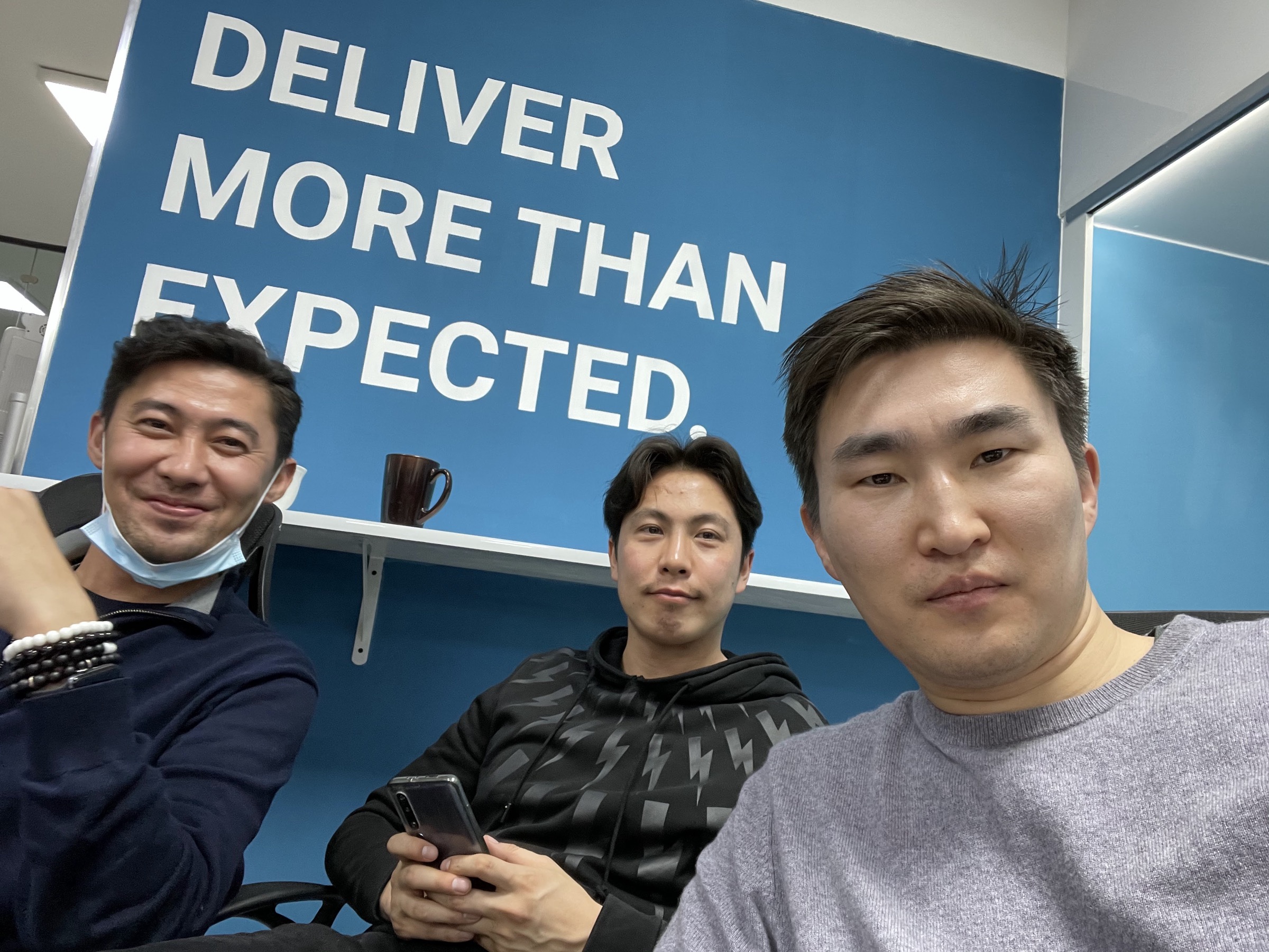 Ider-Od with two colleagues at the CallPro office