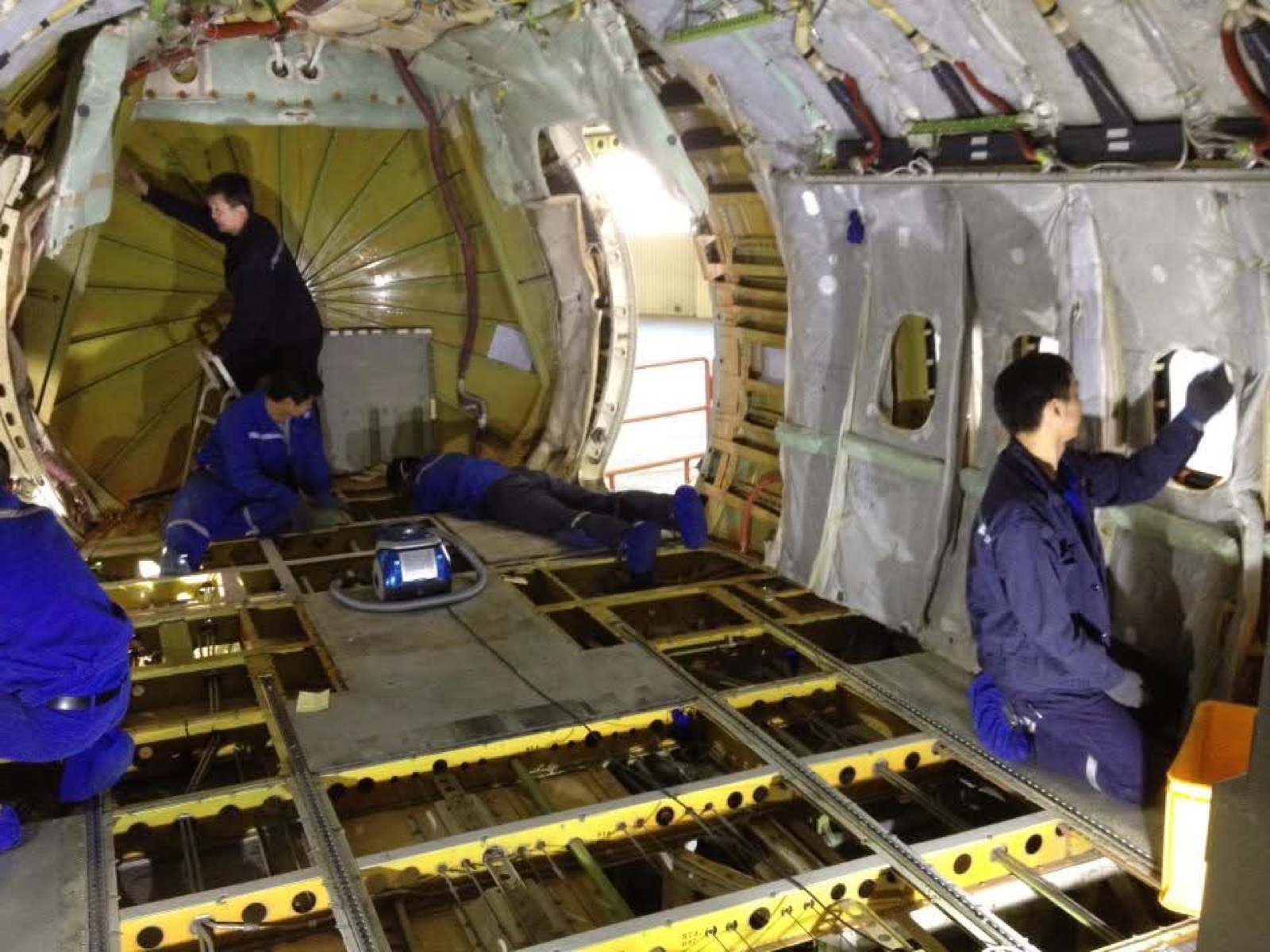 Maintenance work inside an aircraft fuselage