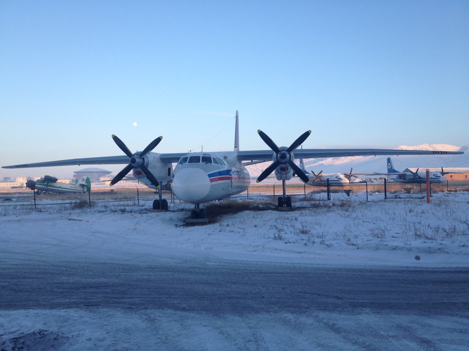 Propeller aircraft on a snowy airfield